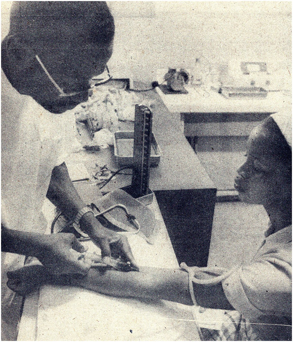 Drawing blood sample, Mozambique, 1980s