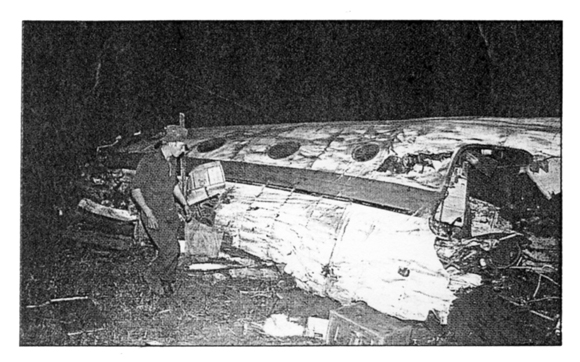 South African soldier by the wreckage