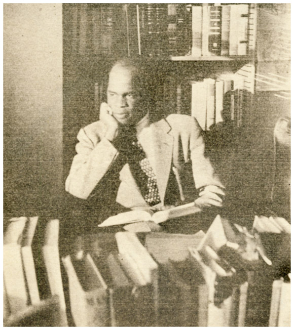 Eduardo Mondlane reading at desk